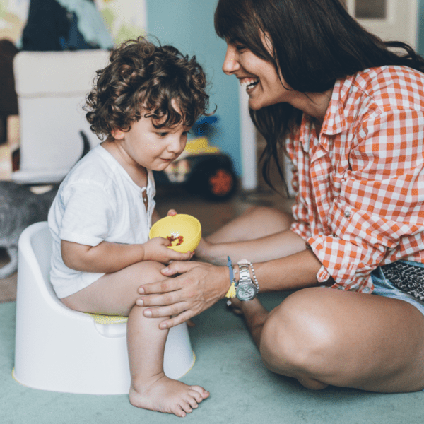 Mother potty training son.