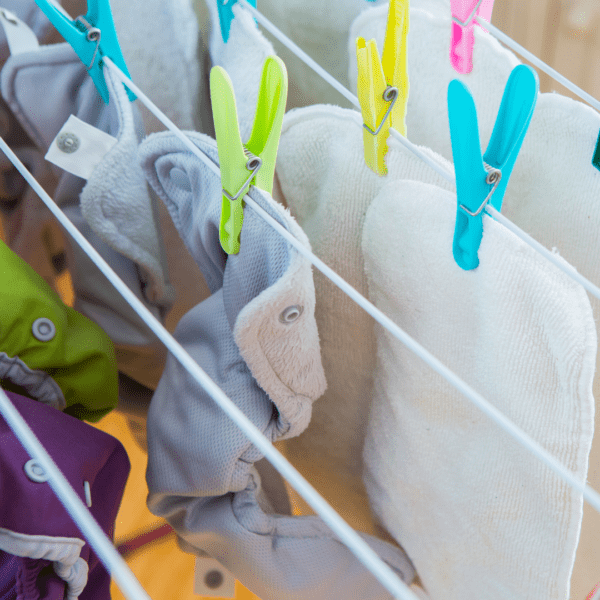 Cloth diapers hanging on a clothes line.