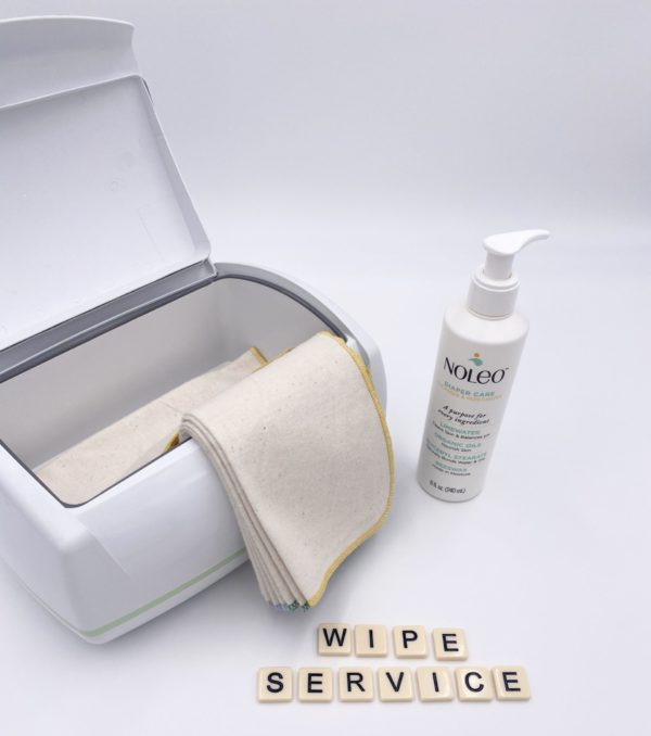 Cloth wipes with Noleo wipe solution by a wipe warmer container.