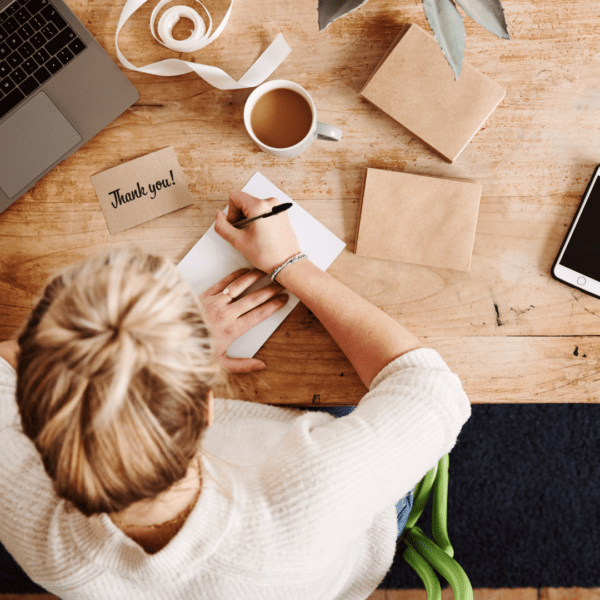 A woman writing letters.