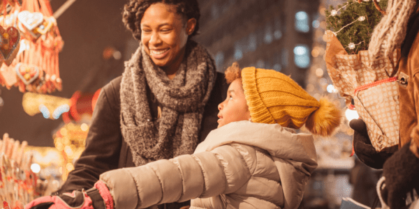 A family looking at gifts during the holidays.