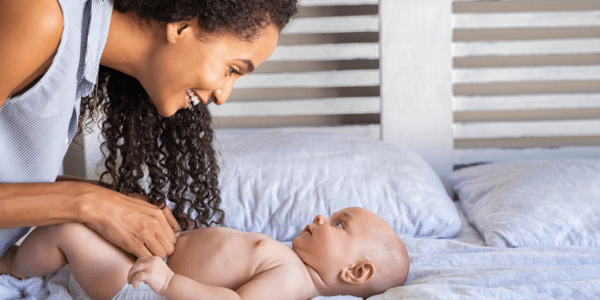 Mom preparing to change her baby's diaper.