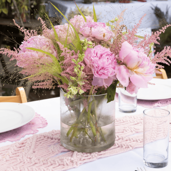 baby shower decorated with flowers and reusable cups and plates